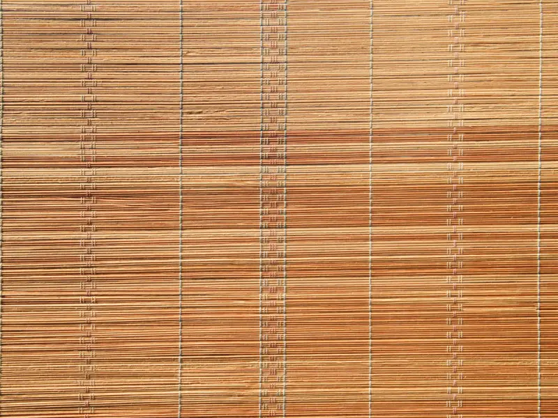 Tightly woven matchstick shades.