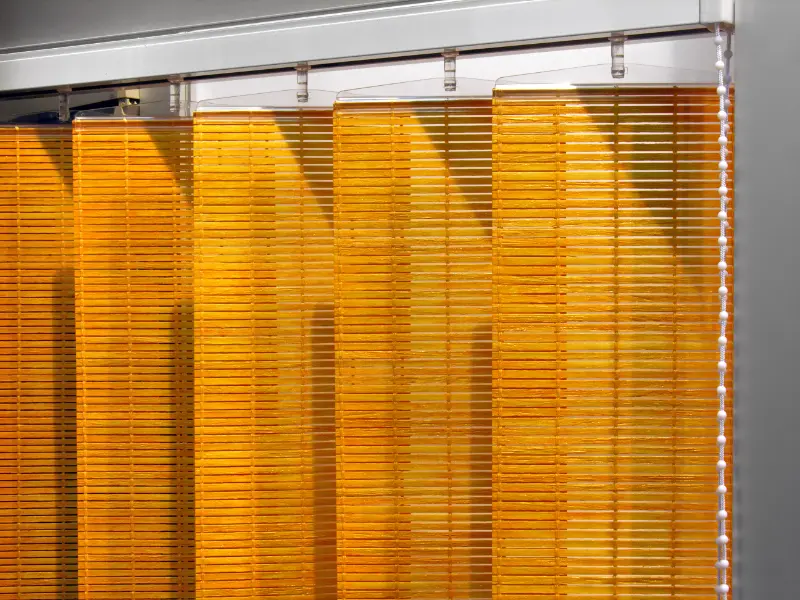Matchstick shades hung like wide slat vertical blinds.