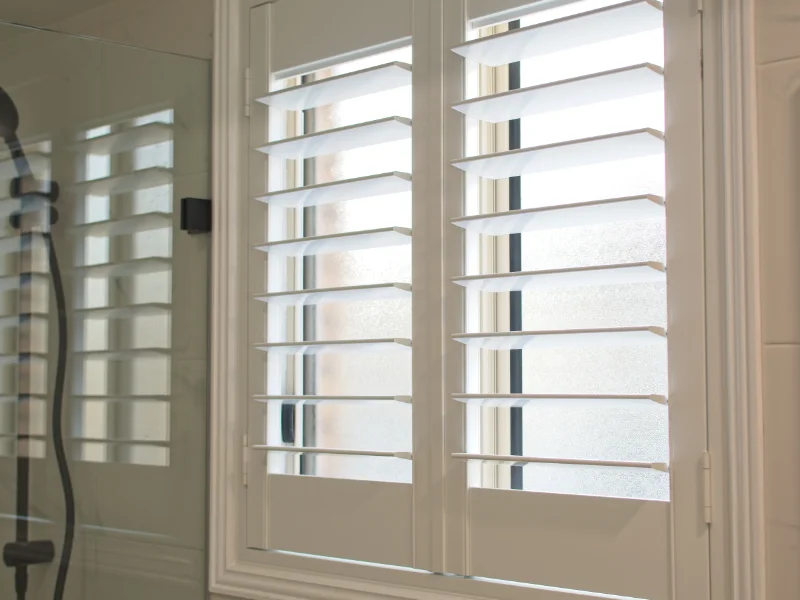 Closeup of the wide slats of plantation shutters.