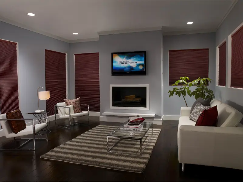 A modern living room with blinds lowered all the way.