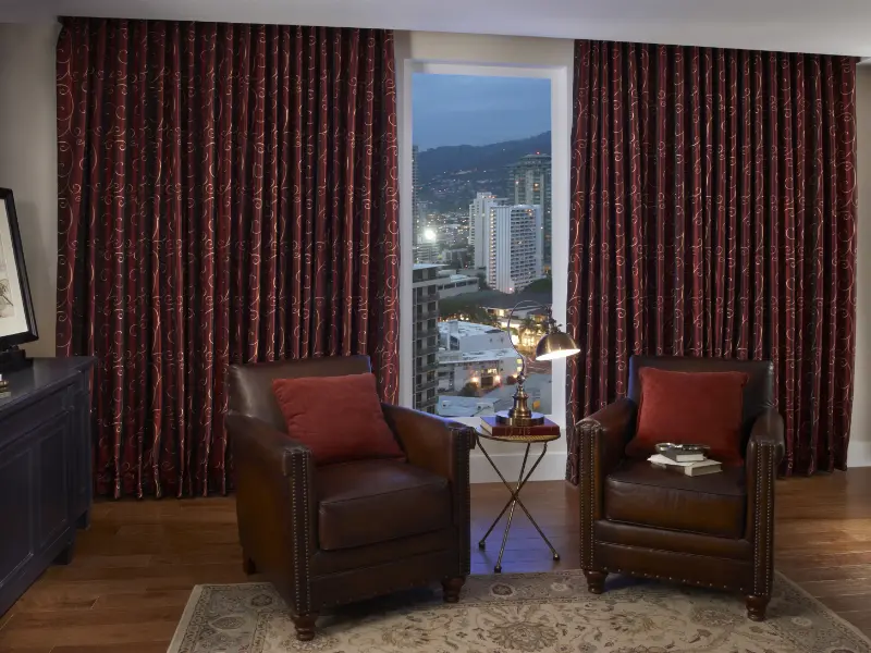 Motorized drapes in a traditional living area.