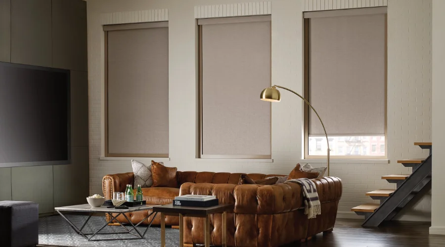 A living room with modern roller shades