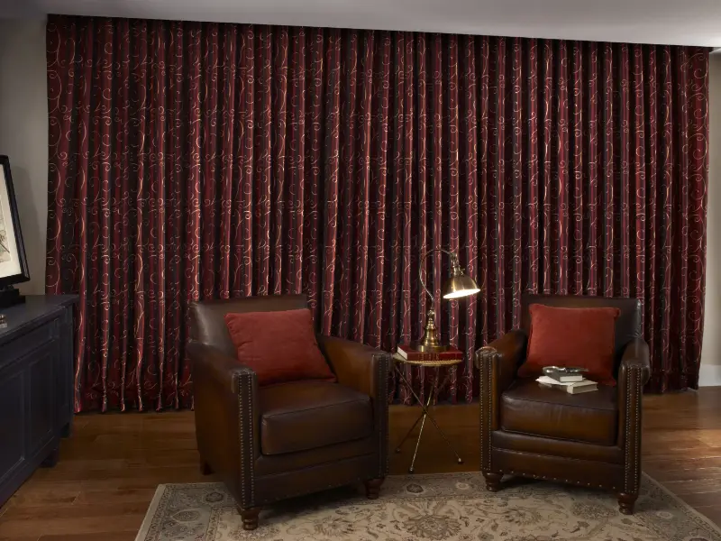 Luxurious floor-length drapes in a living room.