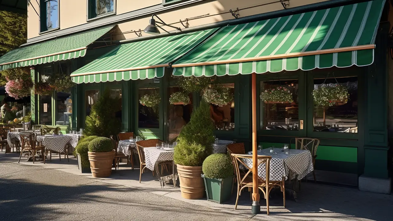 A restaurant with green awnings