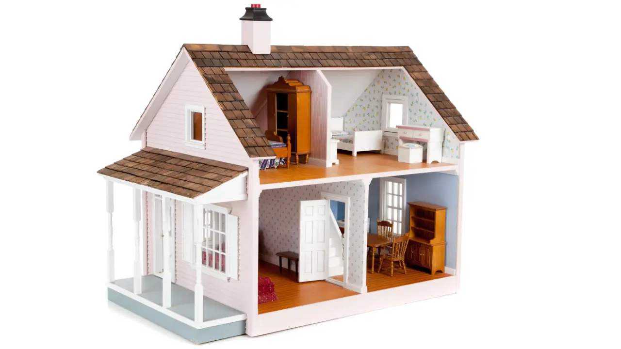 A dollhouse with a kitchen, living room, and bedrooms