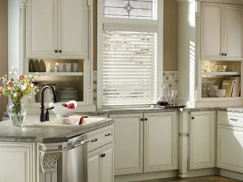 White Venetian blinds in a kitchen window