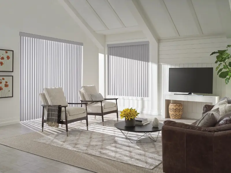Hunter Douglas vertica;l blinds in a contemporary living room.
