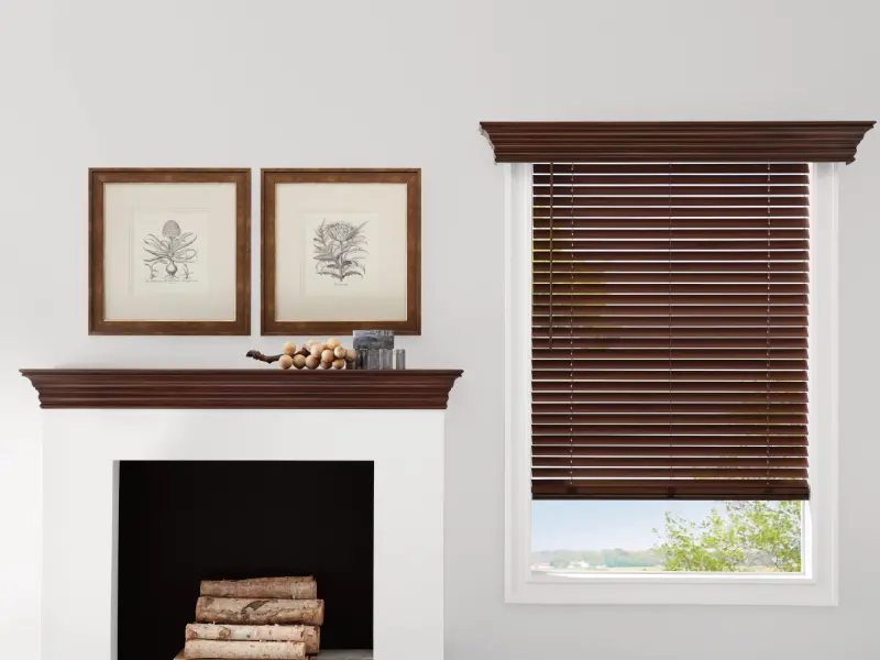 Wooden blinds on a window near the hearth.