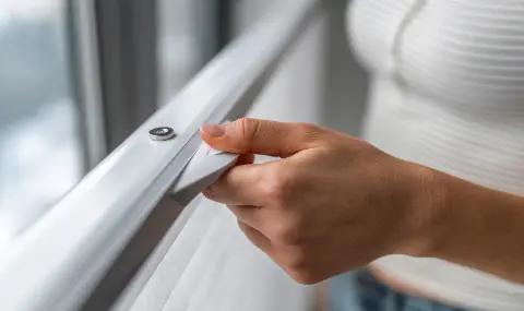 A living room with stationary shades